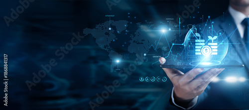 Fotografie Businessman using the tab and analyzing investment data, financial growth planni