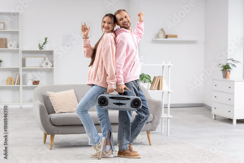 Young couple with boombox a...