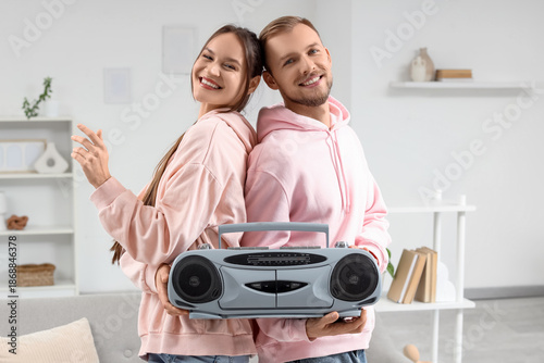 Young couple with boombox a...