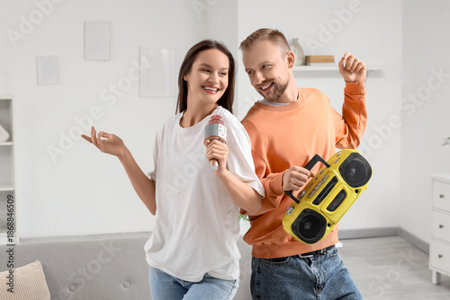 Young couple with boombox a...
