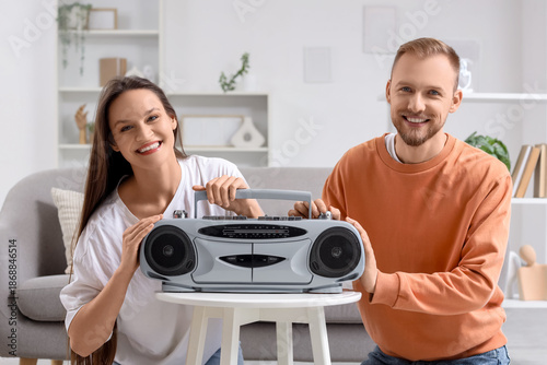Young couple with boombox o...