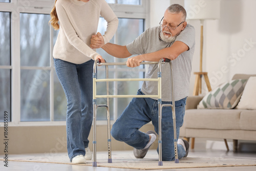 Young woman helping her gra...