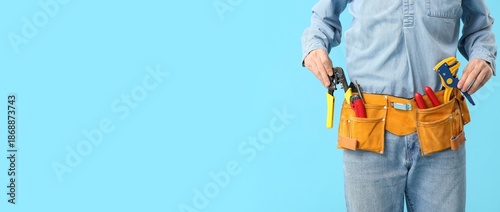 Male electrician with tools...