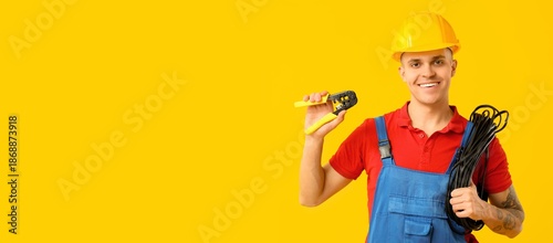 Young male electrician on y...