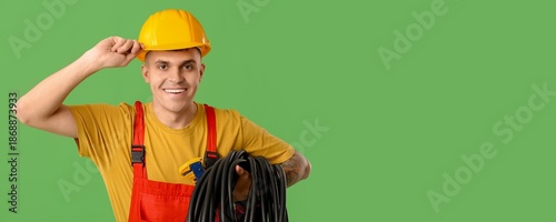 Young male electrician on g...