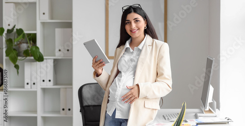 Pregnant businesswoman with...