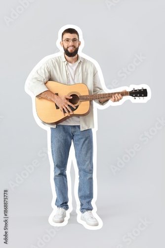 Young bearded man playing g...