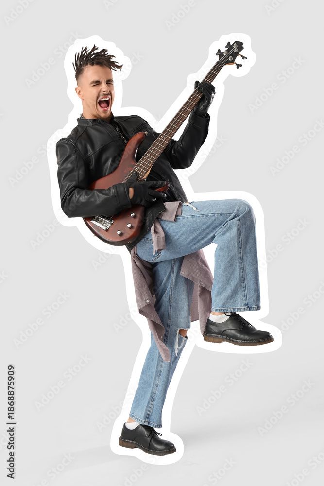 Naklejka premium Cool young man with dreadlocks playing guitar on white background