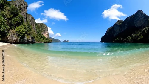 Tropical Beach with Waves and Cliffs.