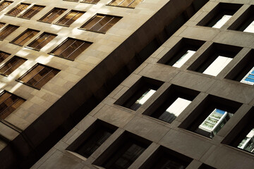 Sunlit concrete and glass patterns