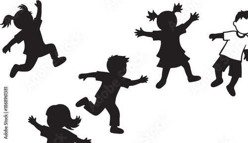 Silhouettes of happy children playing and running together freely