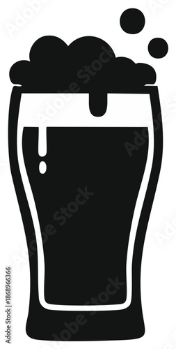 Iconic glass of dark beer with foamy head and bubbles