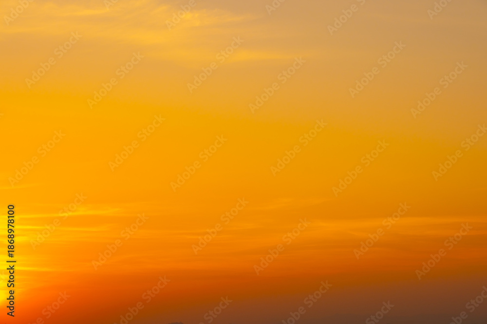 Fototapeta premium Enjoy a panoramic view of the skyline. The sun rises in the morning sky with colorful clouds. and beautiful cloud patterns In the soft light of the morning 