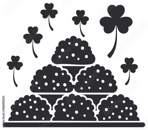 Black silhouette of clover leaves and layered mounds with white dots