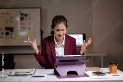 Tableau sur toile Frustrated businesswoman experiencing work stress and burnout in office