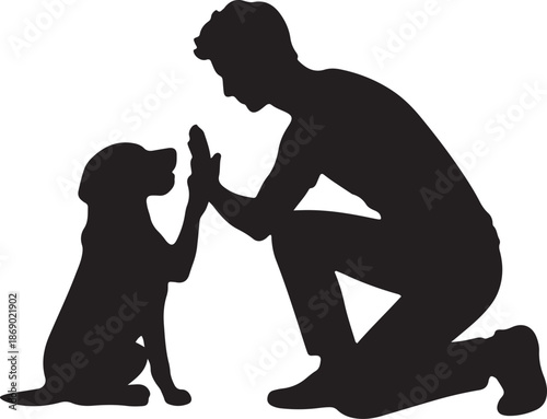 silhouette of a man with his dog giving high five in friendly way