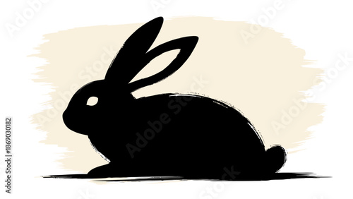 Black silhouette of a rabbit sitting in front of a beige background