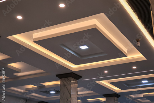 Fotografía Ornate Ceiling Design with Geometric Patterns and Cove Lighting Creates a Luxuri