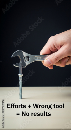 hand holding a wrench on a white background