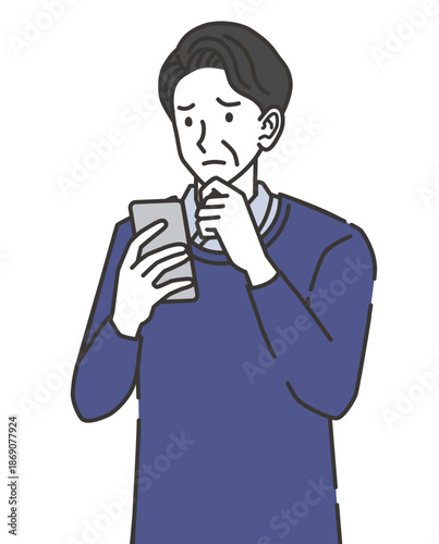 スマホを見ながら悩む中年男性