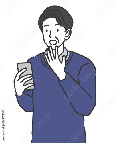 スマホを見て驚く中年男性