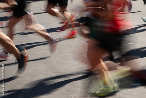 Runners Sprinting During a Vibrant Race Event in the City Streets