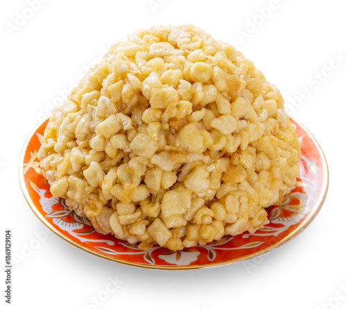 Tatarian delight Chak-chak on a plate isolated white background. A sample for design