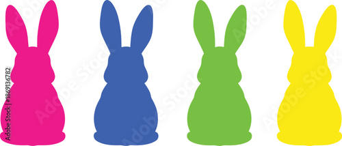 Four colorful plastic easter bunnies in a row