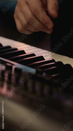 Hands Create Magic on Piano Keys in a Cozy Space