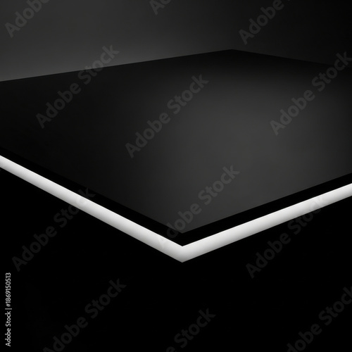 Black rectangular panel with illuminated white edge on dark background