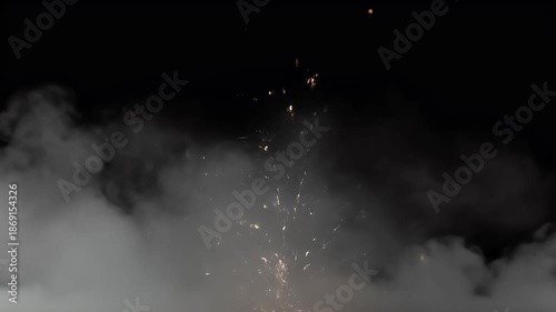 Exploding Sparks And Dense Smoke On Black Background