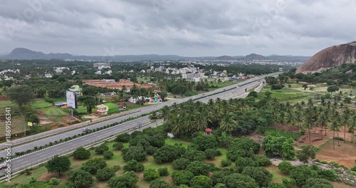 A drone shot of Bangalore Mysore Expressway with winding roads, and serene landscapes