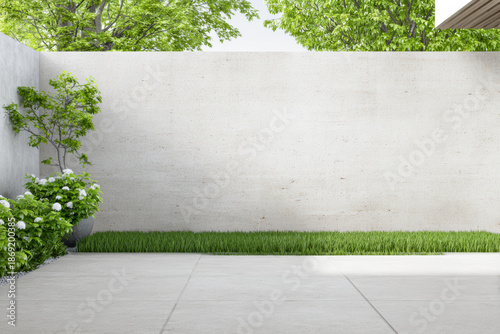 Wallpaper Mural Modern outdoor space with concrete wall, plants, and grass in bright daylight with clear blue sky above Torontodigital.ca