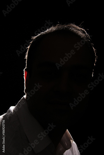 Wallpaper Mural Portrait of an Iranian man whose face is not visible with a black background Torontodigital.ca