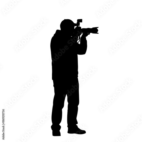 Silhouette of a cameraman filming with a professional video camera and external flash