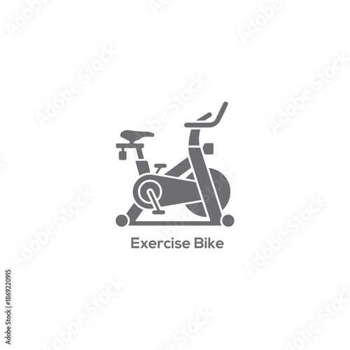 Minimalist gray exercise bike logo icon featuring a stationary cycling machine for fitness gym training and healthy active sports.
