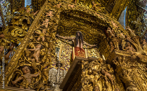 Fotografie Intricate golden altar with religious figures