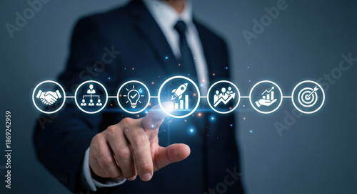 Businessman touching glowing startup rocket icon in conceptual business strategy interface