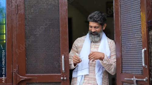 indian farmer standing at home 