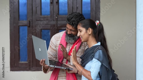 farmer using laptop with daughter