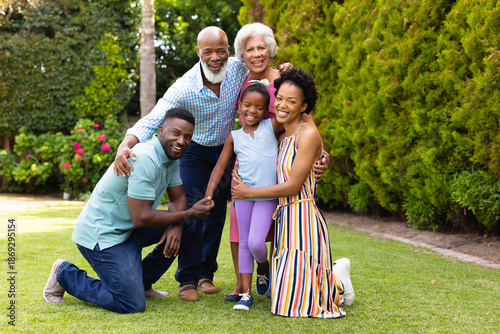 Фотография Portrait of cheerful three generational african american family at the backyard