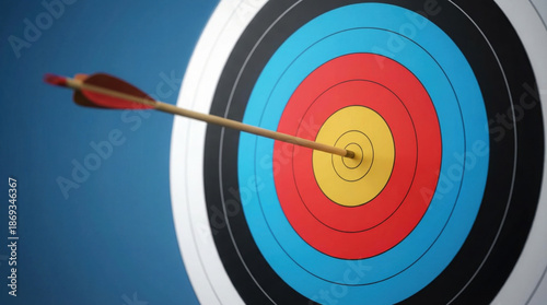 Arrow hitting the bullseye on a colorful target