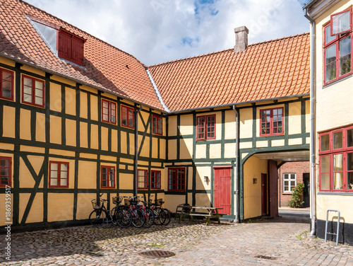 Courtyard of merchant's yard Muusgaarden with half-timbered walls in old town Kerteminde, Funen, Southern Denmark