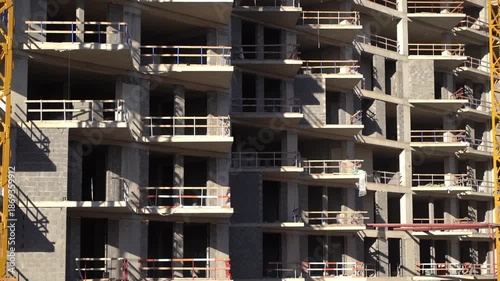 Construction of a building. Construction site with crane. Business, development, industry.