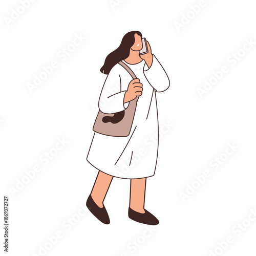 Woman walking outdoors, speaking on mobile phone. Young female in dress, tote...