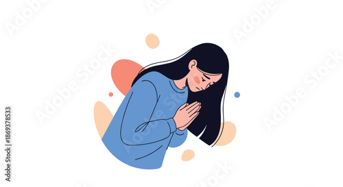 Young woman in a blue sweater with long dark hair holds her hands together in a prayer or pleading gesture with a sad expression on her face.