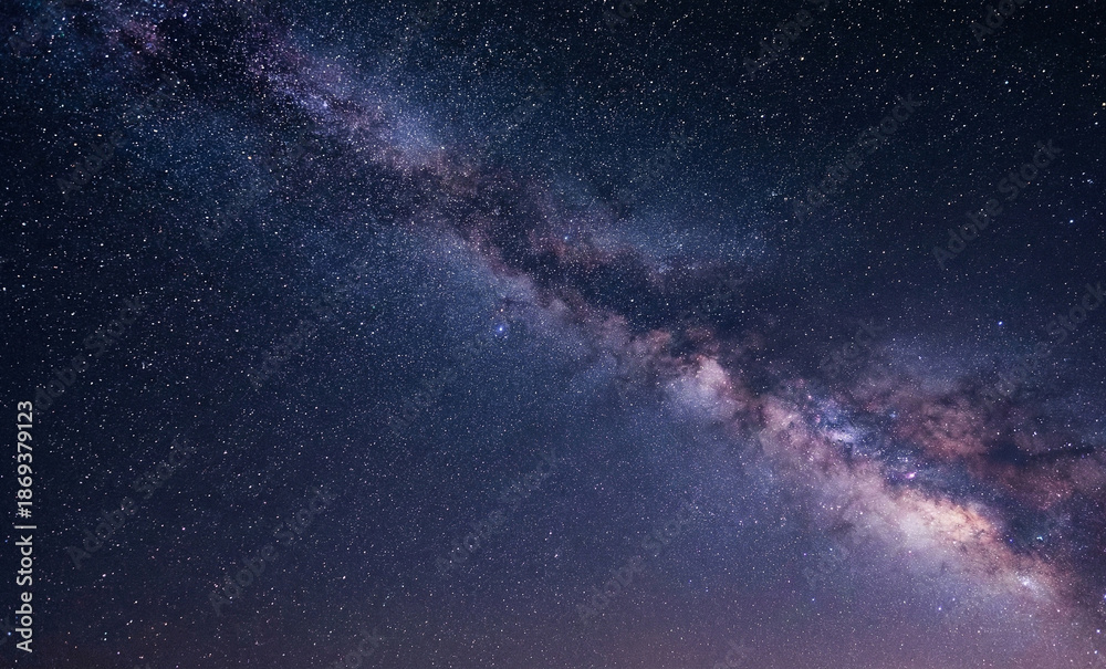 Fototapeta premium stunning milky way galaxy across the night sky, dense stars, soft cosmic glow