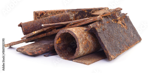 Slika na platnu Pile of rusty metal scrap isolated on white background