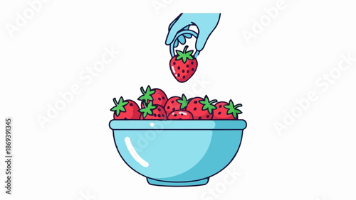 Hand picking a strawberry from a bowl full of ripe strawberries