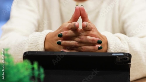 hands holding a laptop, hesitant or undecided